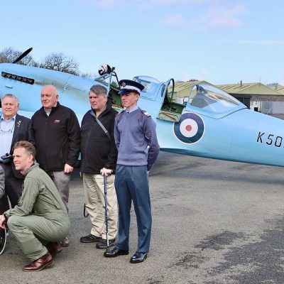 HISTORIC: RAF veterans and Cadets pose with the rare spitfire at Prestwick's runway (Image: Eddie Wallace)