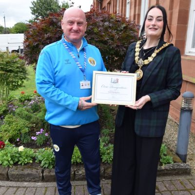 IMPACT: The Killie Community's Scott Montgomery  receives a certificate of civic recognition from Provost Claire Leitch (Image: East Ayrshire Council)