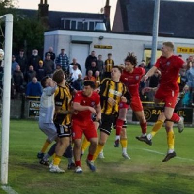 CLASH: Lewis Lovering put Troon ahead in the midweek clash at Beechwood (Image: Troon Football Club)